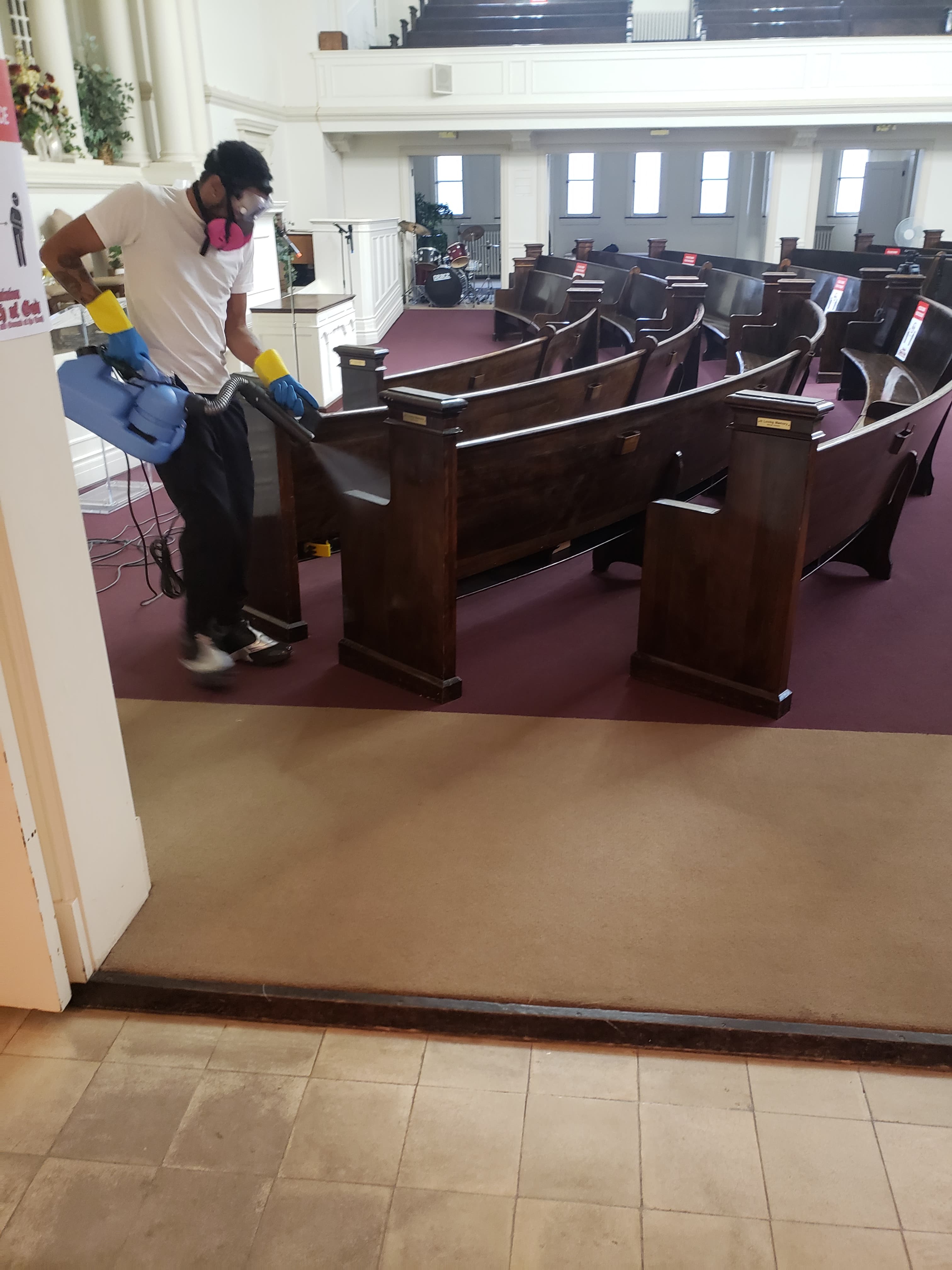 a man cleaning a church